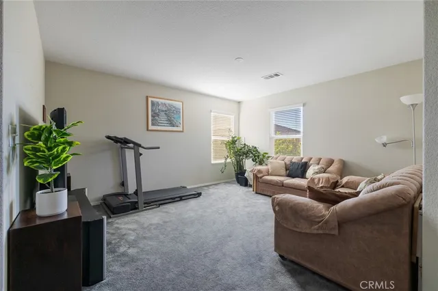 a bed room with furniture and a window