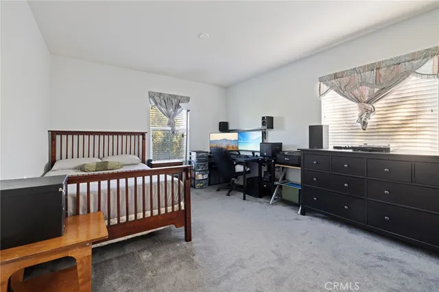 a view of room with furniture and windows