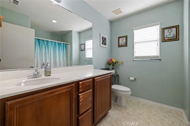a view of a hallway with wooden floor and stairs