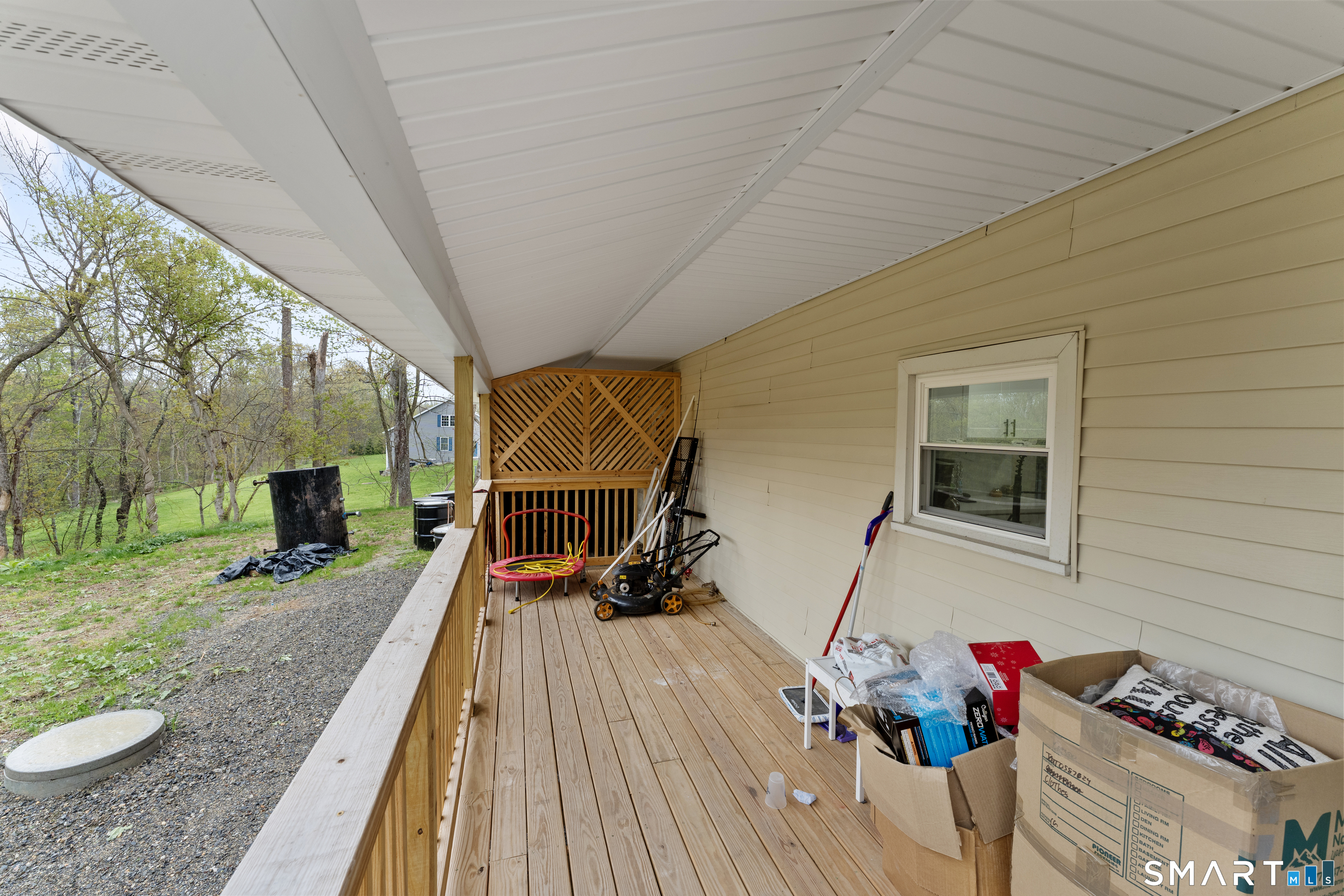 859 Ekonk Hill Road Voluntown, CT 06384 - Photo 3 of 25 a sitting area with furniture and wooden deck