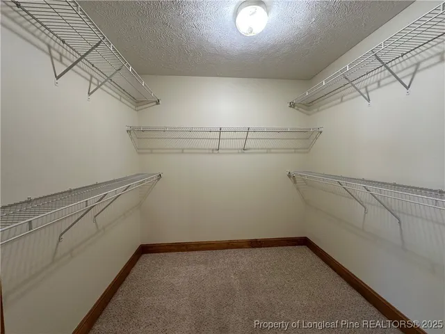 a view of a room with racks on the wall