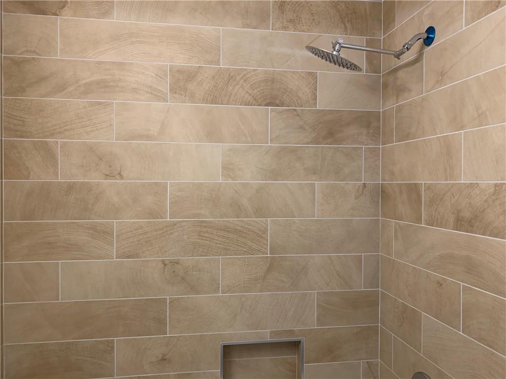 1261 Concord Road Southeast Smyrna, GA 30080 - Photo 17 of 50 a bathroom with a shower