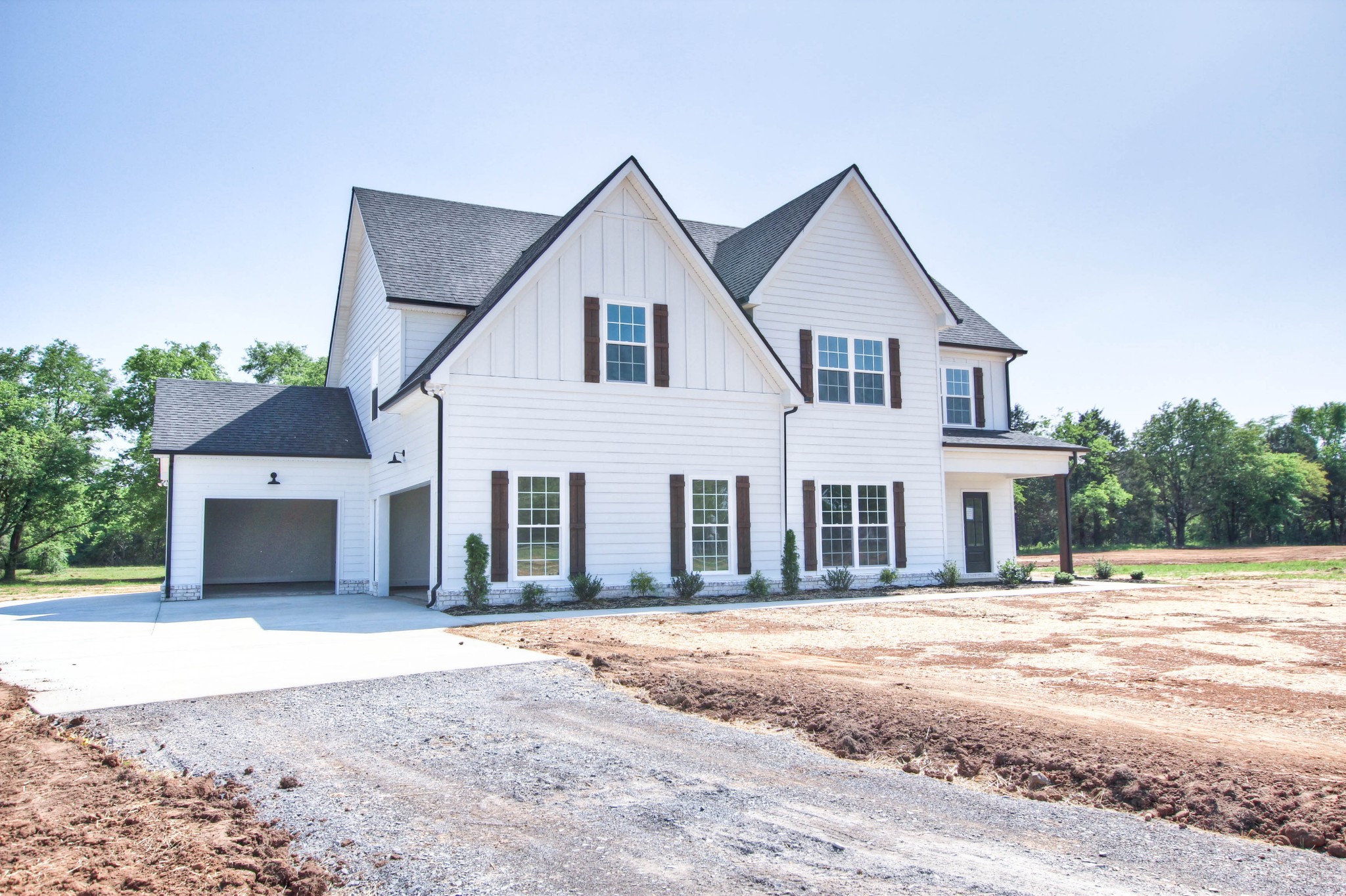 1533 Harrison Road Murfreesboro, TN 37128 - Photo 4 of 42 a front view of a house with a garden