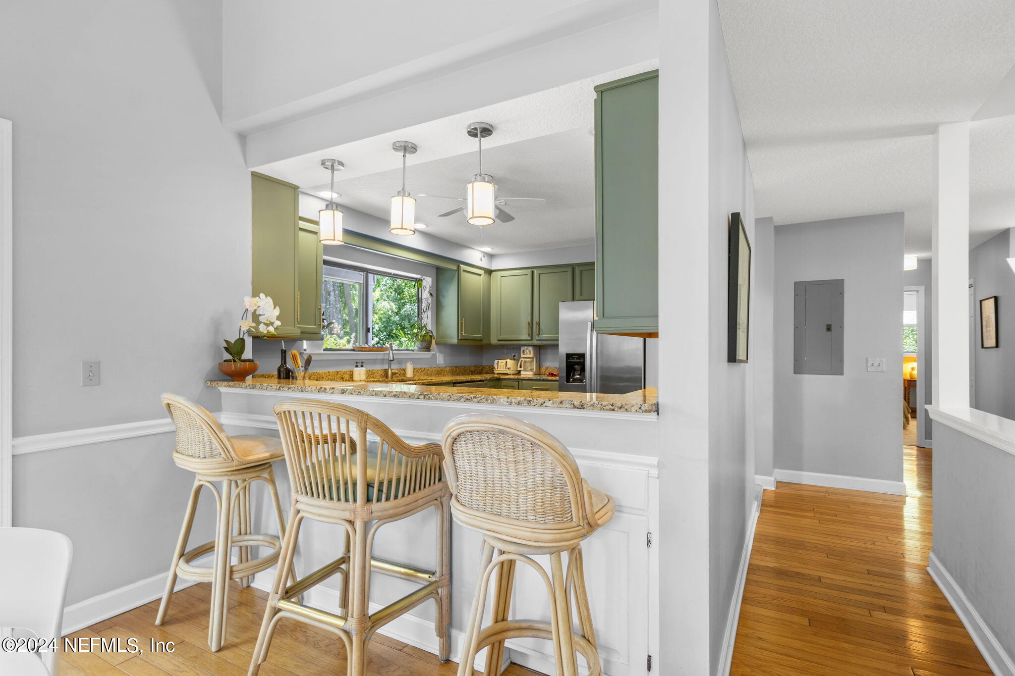 1350 Pinewood Road Jacksonville Beach, FL 32250 - Photo 12 of 55 a dining hall with granite countertop a dining table and chairs
