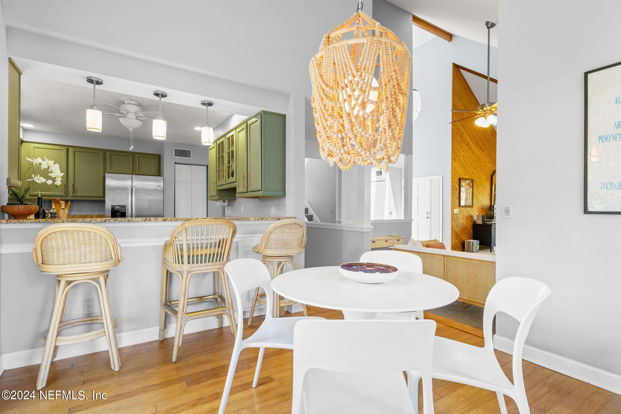 1350 Pinewood Road Jacksonville Beach, FL 32250 - Photo 15 of 55 a view of a dining room with furniture and wooden floor