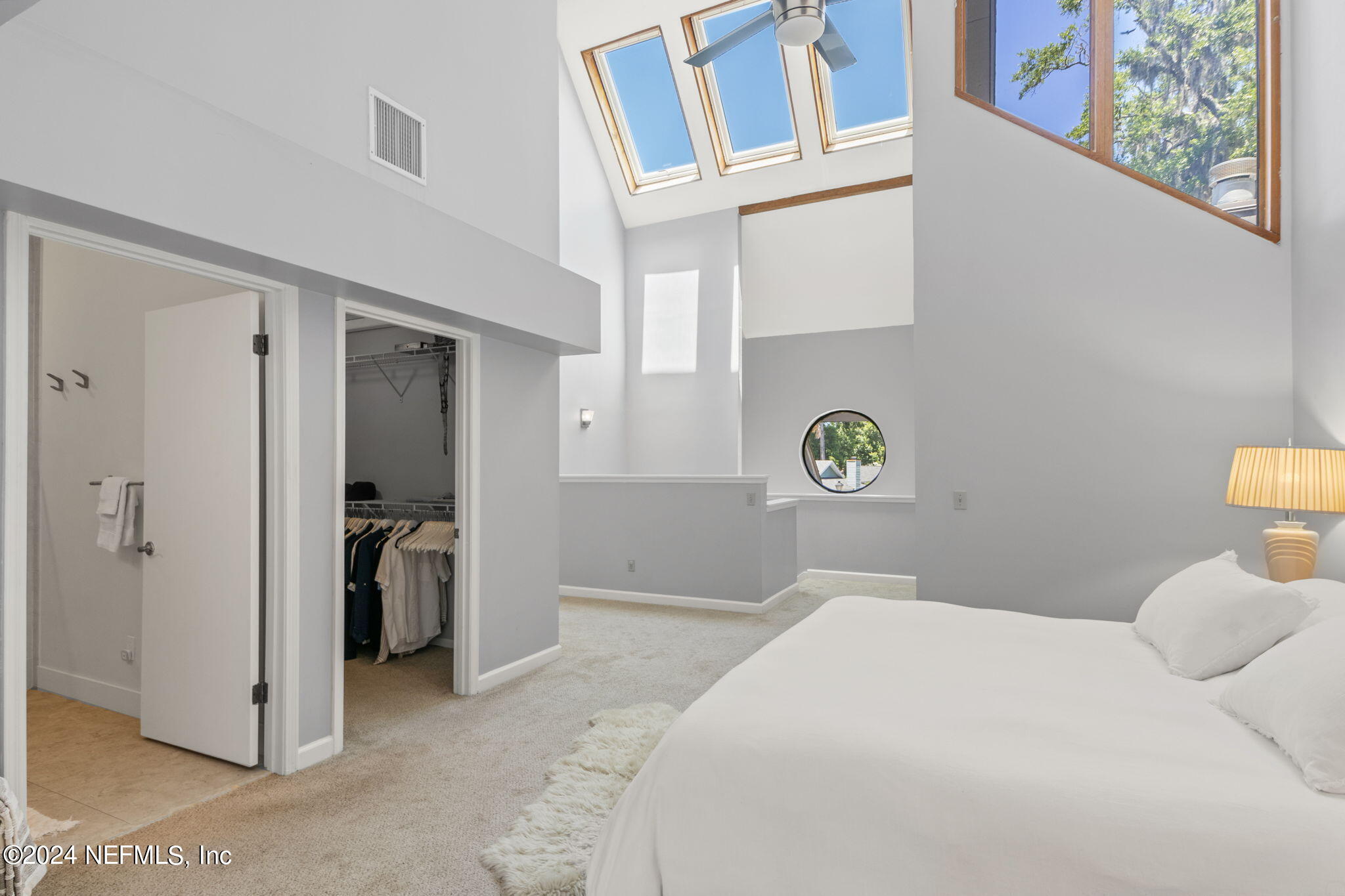 1350 Pinewood Road Jacksonville Beach, FL 32250 - Photo 23 of 55 a bedroom with a bed and a cabinets