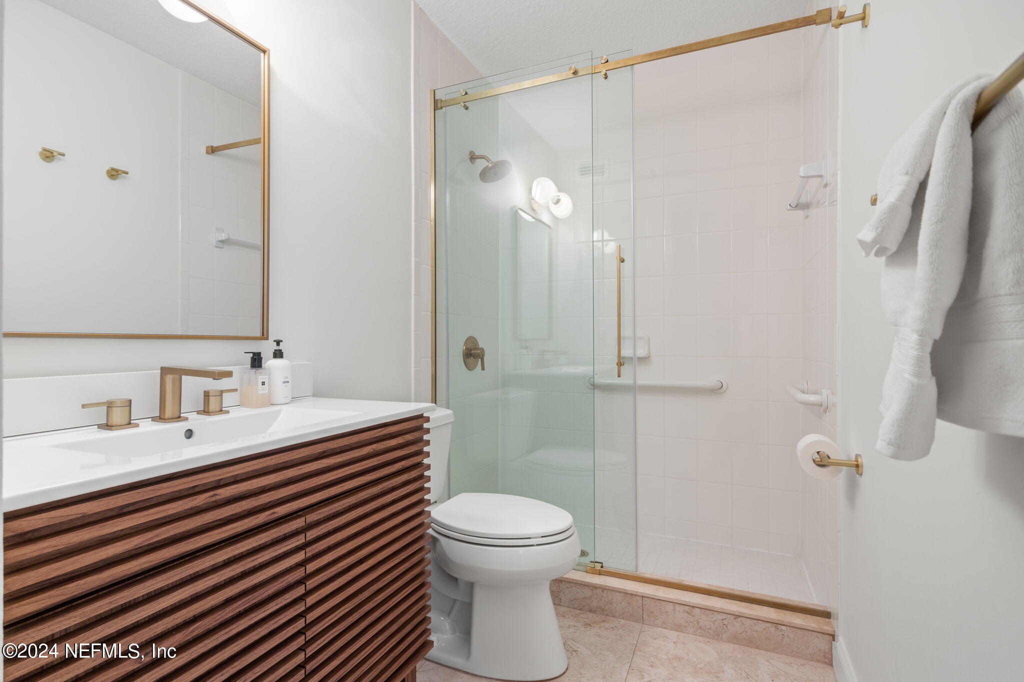 1350 Pinewood Road Jacksonville Beach, FL 32250 - Photo 26 of 55 a bathroom with a sink a toilet and shower