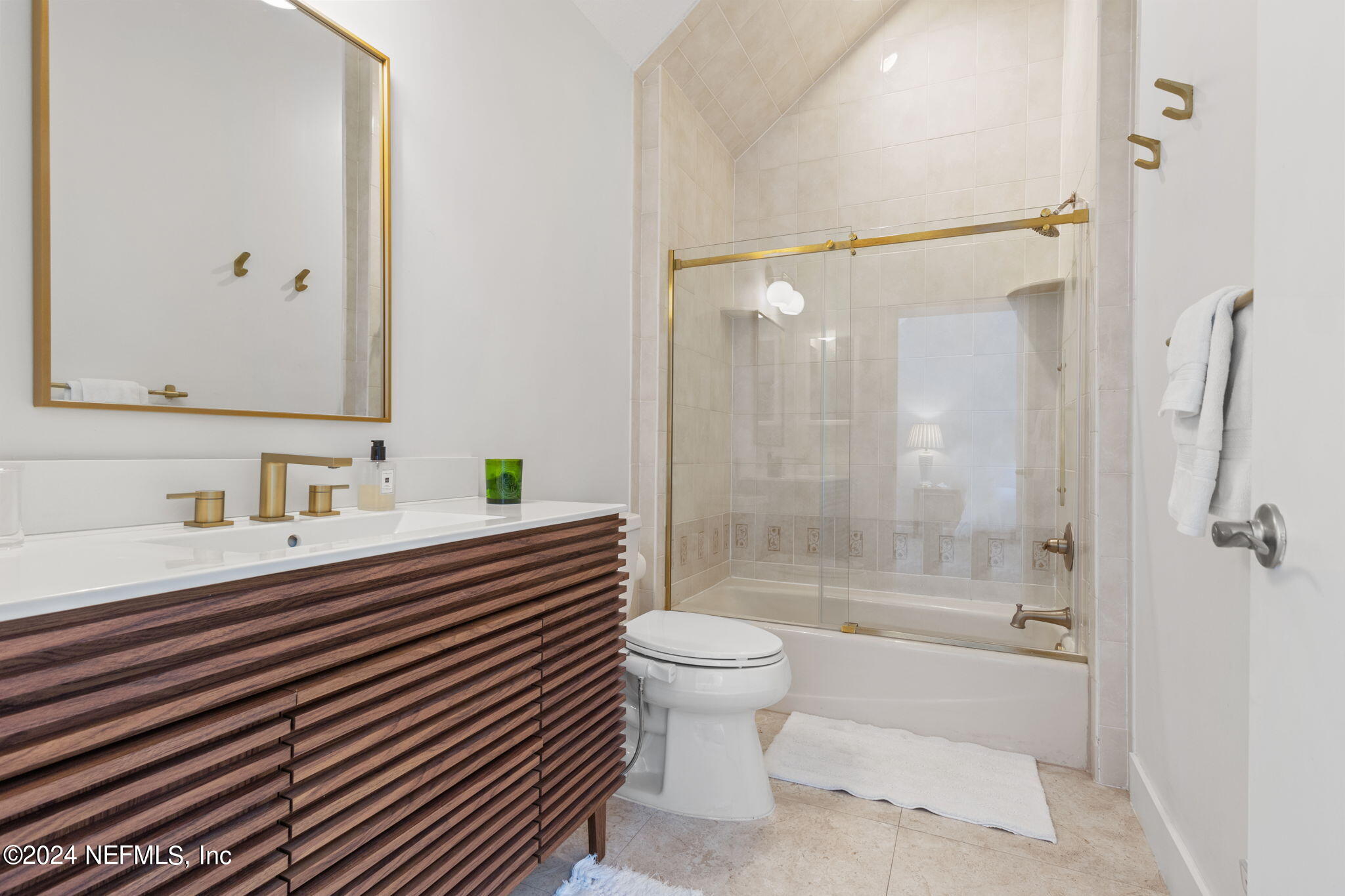 1350 Pinewood Road Jacksonville Beach, FL 32250 - Photo 27 of 55 a bathroom with a sink mirror toilet and bathtub