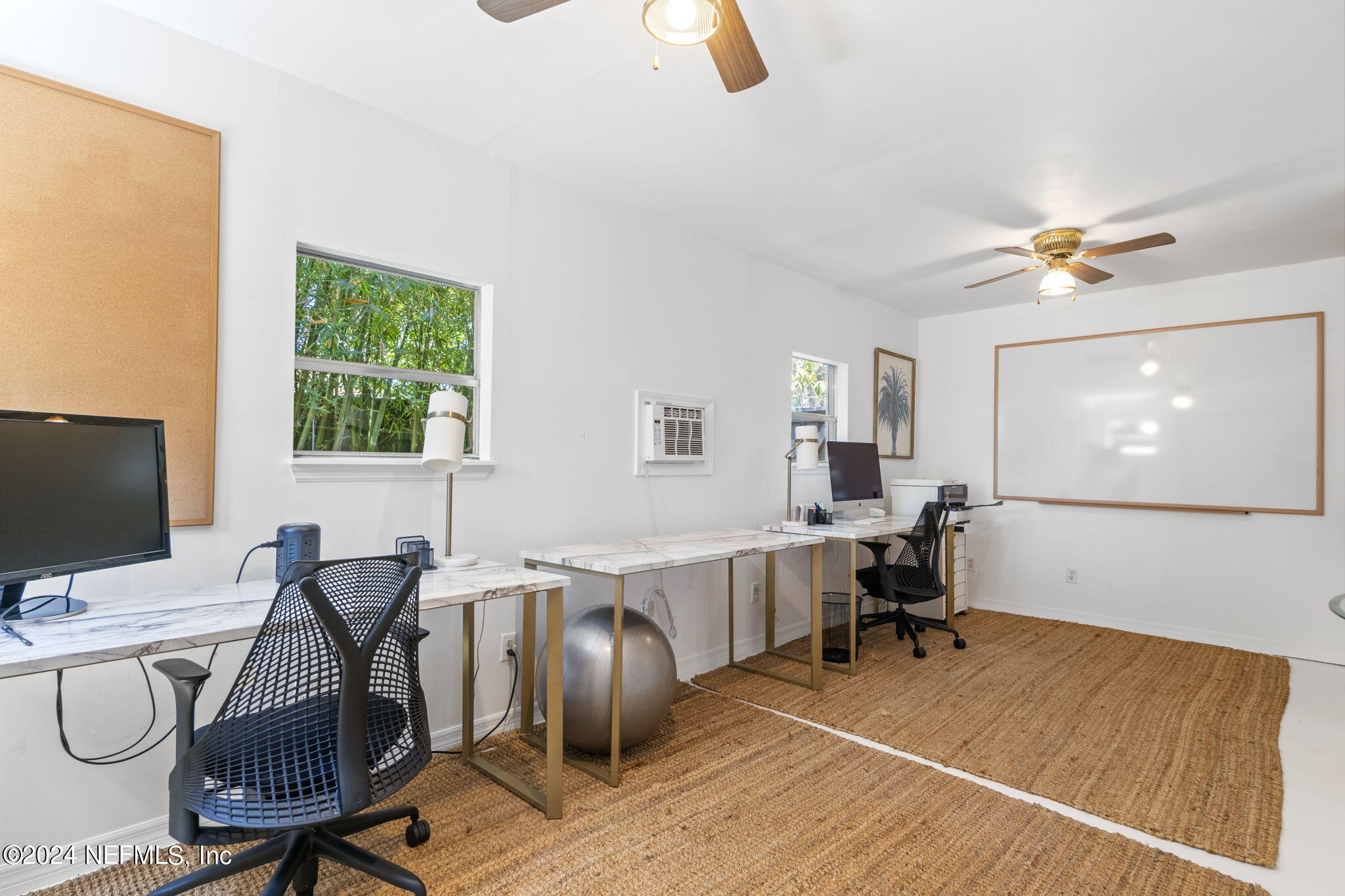1350 Pinewood Road Jacksonville Beach, FL 32250 - Photo 30 of 55 a view of a workspace with furniture and a window