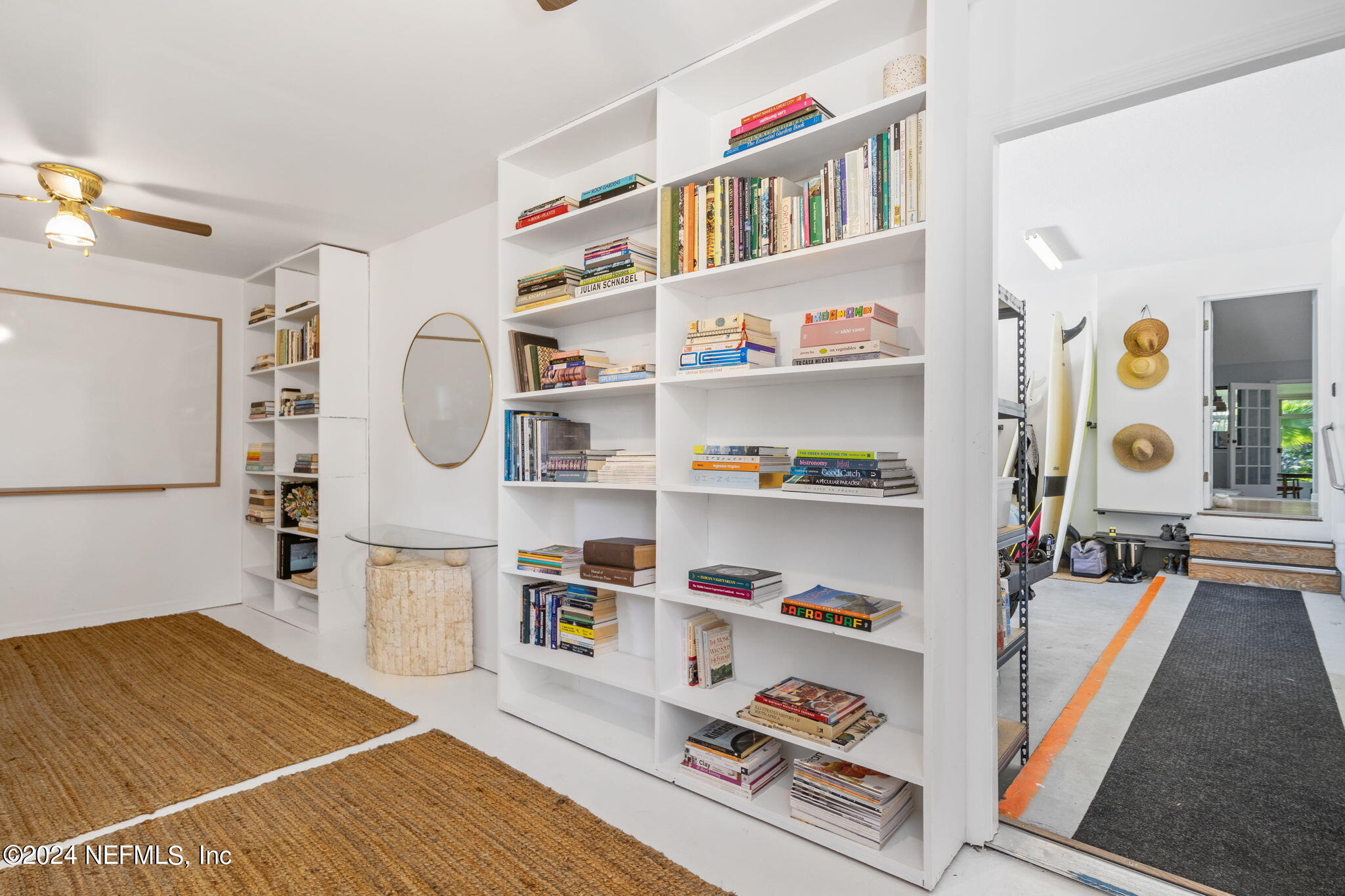 1350 Pinewood Road Jacksonville Beach, FL 32250 - Photo 31 of 55 a living room with furniture cabinets and a wooden floor