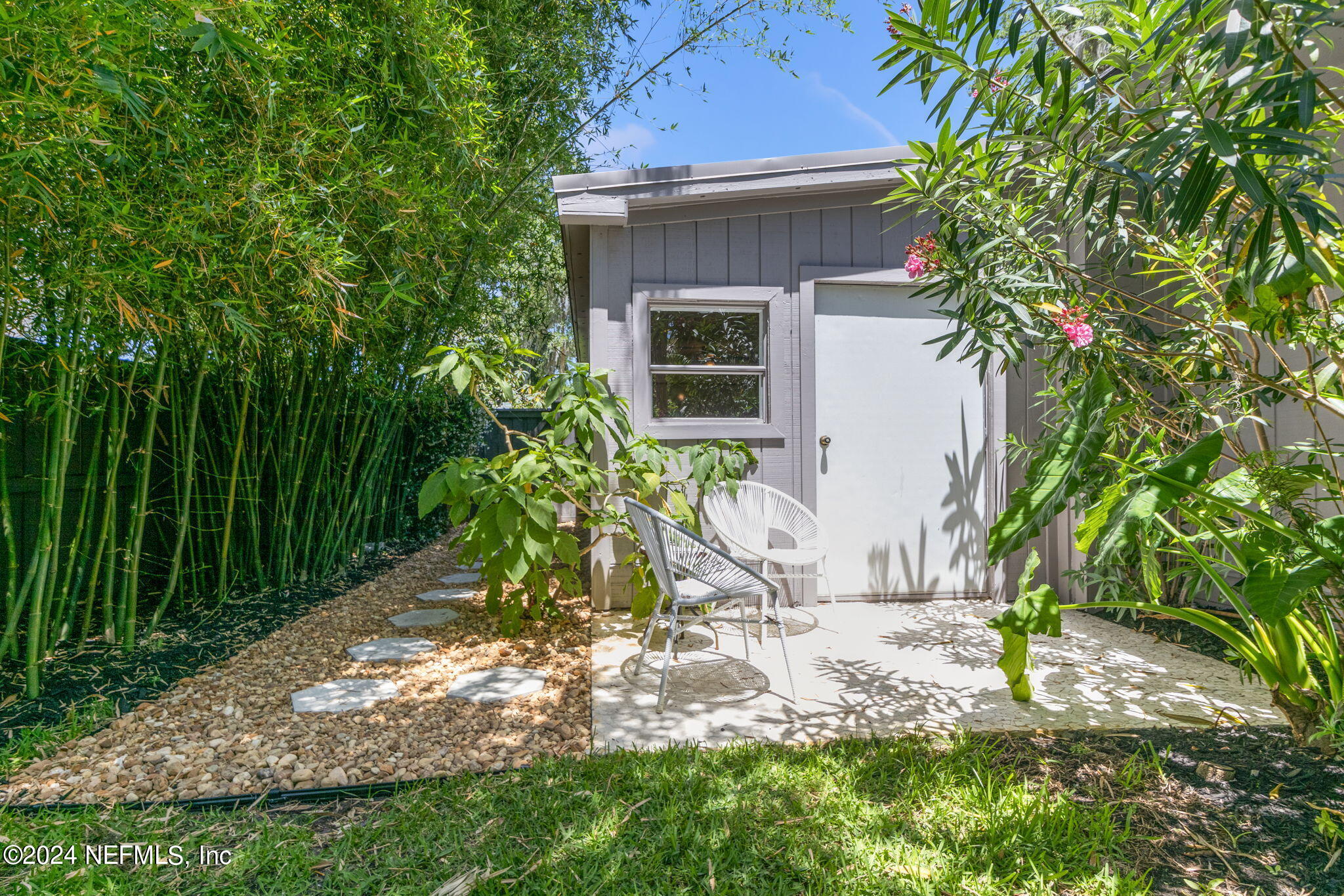 1350 Pinewood Road Jacksonville Beach, FL 32250 - Photo 42 of 55 a view of a backyard with potted plants