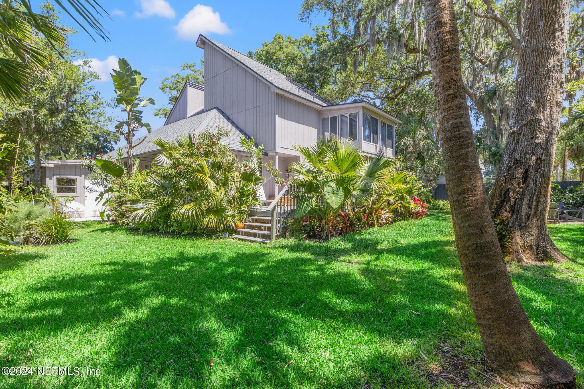 1350 Pinewood Road Jacksonville Beach, FL 32250 - Photo 43 of 55 a backyard of a house with lots of green space