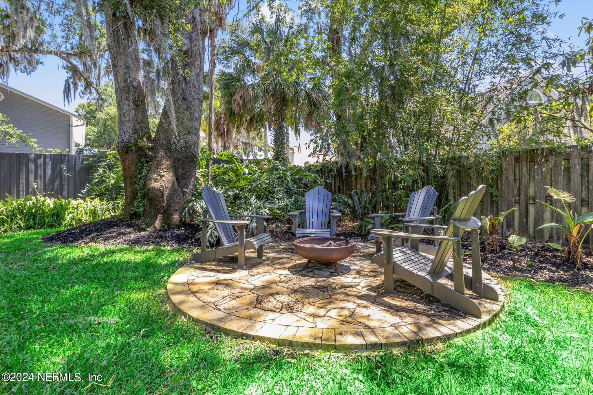 1350 Pinewood Road Jacksonville Beach, FL 32250 - Photo 45 of 55 a view of a backyard with a patio
