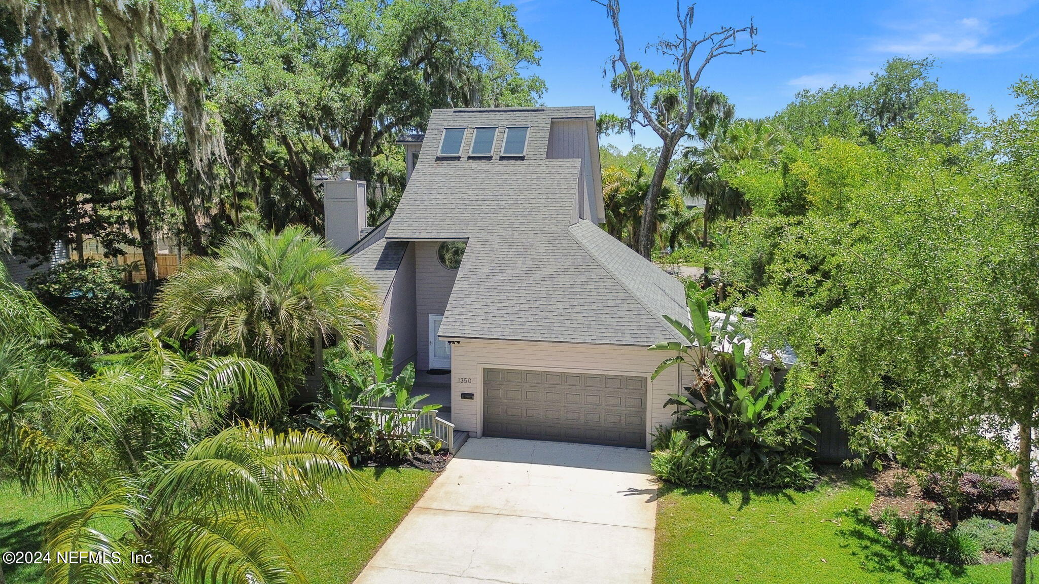 1350 Pinewood Road Jacksonville Beach, FL 32250 - Photo 46 of 55 a aerial view of a house with a yard and potted plants