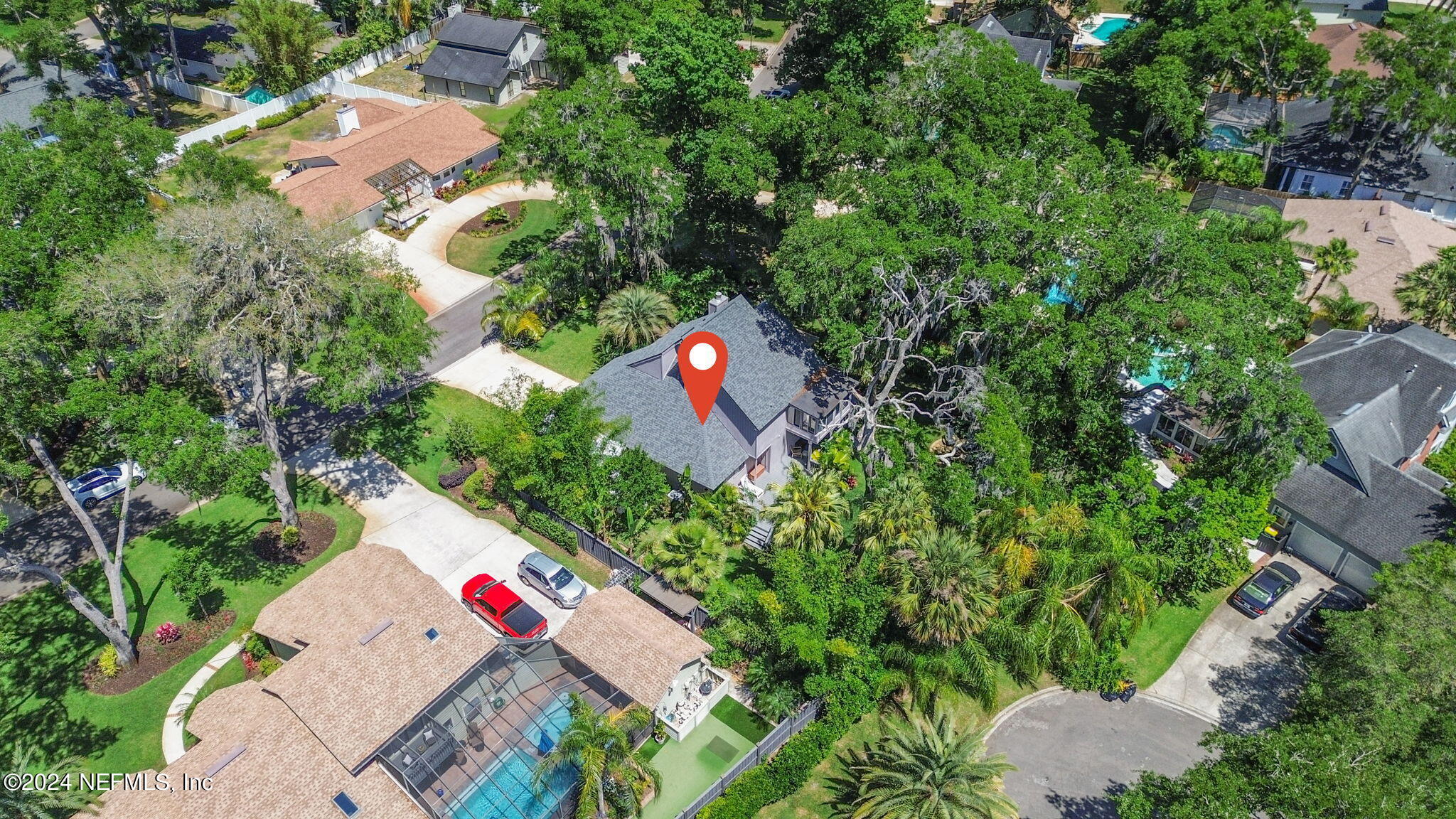 1350 Pinewood Road Jacksonville Beach, FL 32250 - Photo 50 of 55 an aerial view of a house with a yard and garden