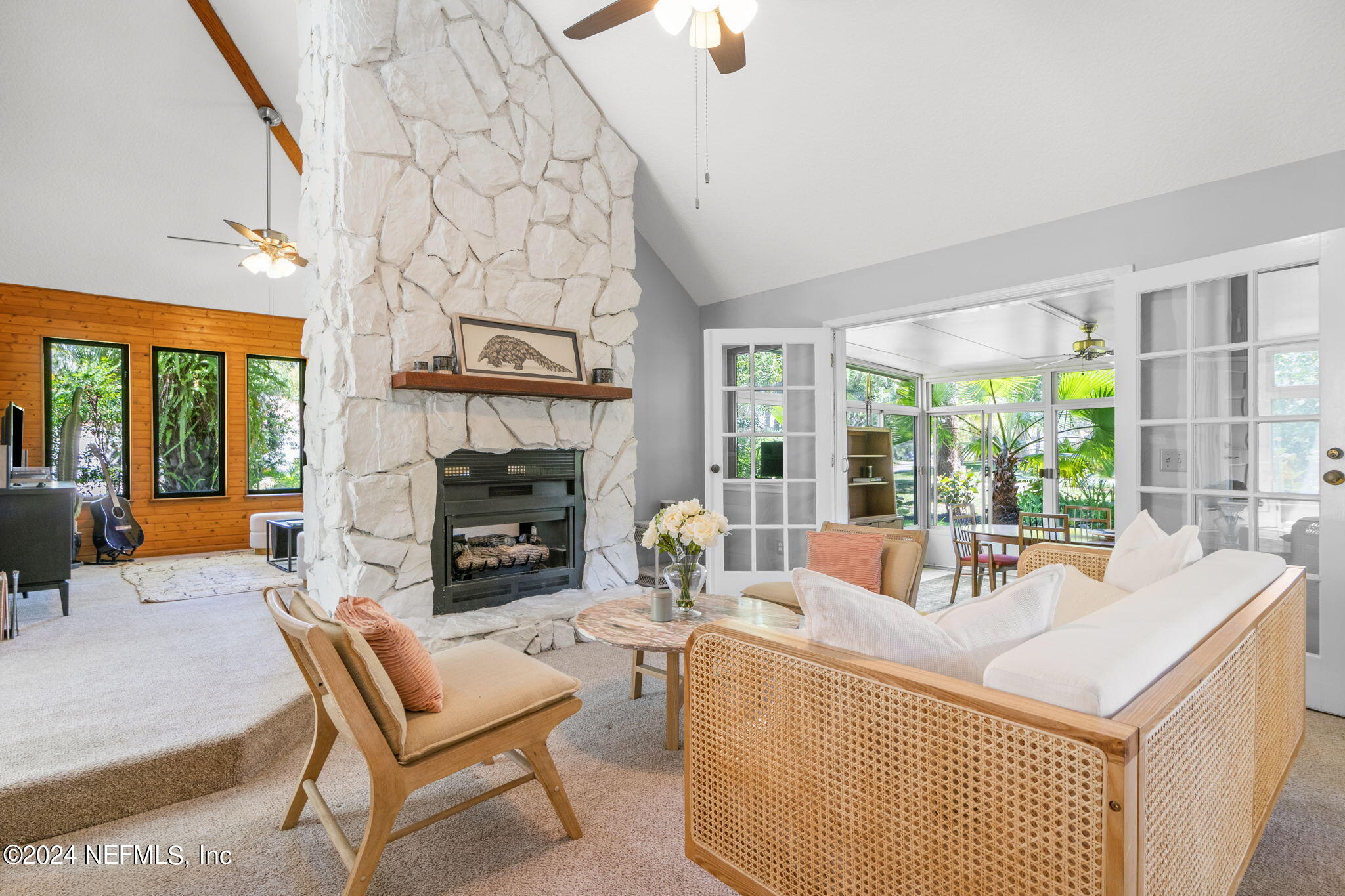 1350 Pinewood Road Jacksonville Beach, FL 32250 - Photo 6 of 55 a living room with furniture and a fireplace