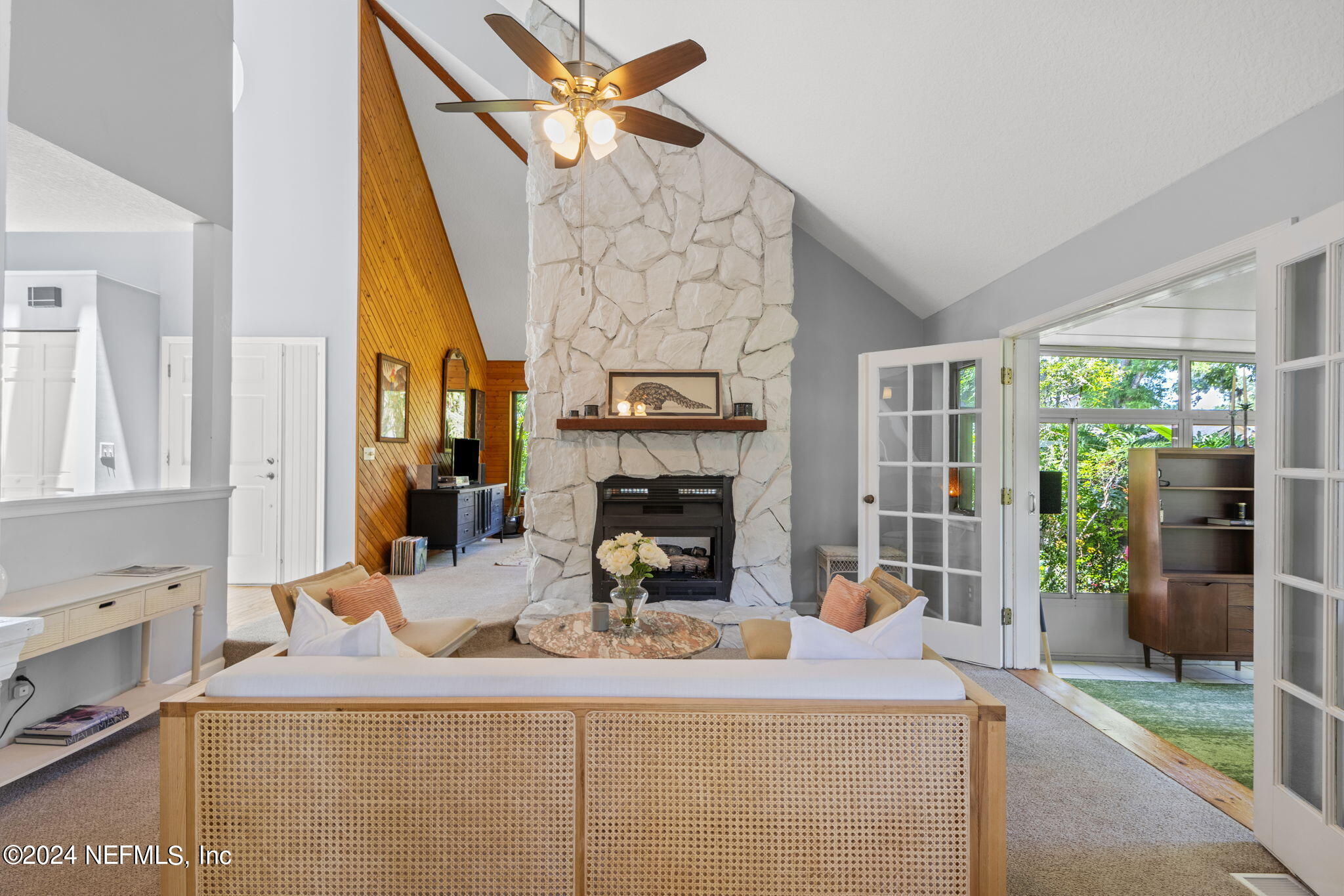 1350 Pinewood Road Jacksonville Beach, FL 32250 - Photo 8 of 55 a living room with fireplace furniture a fireplace and a large window