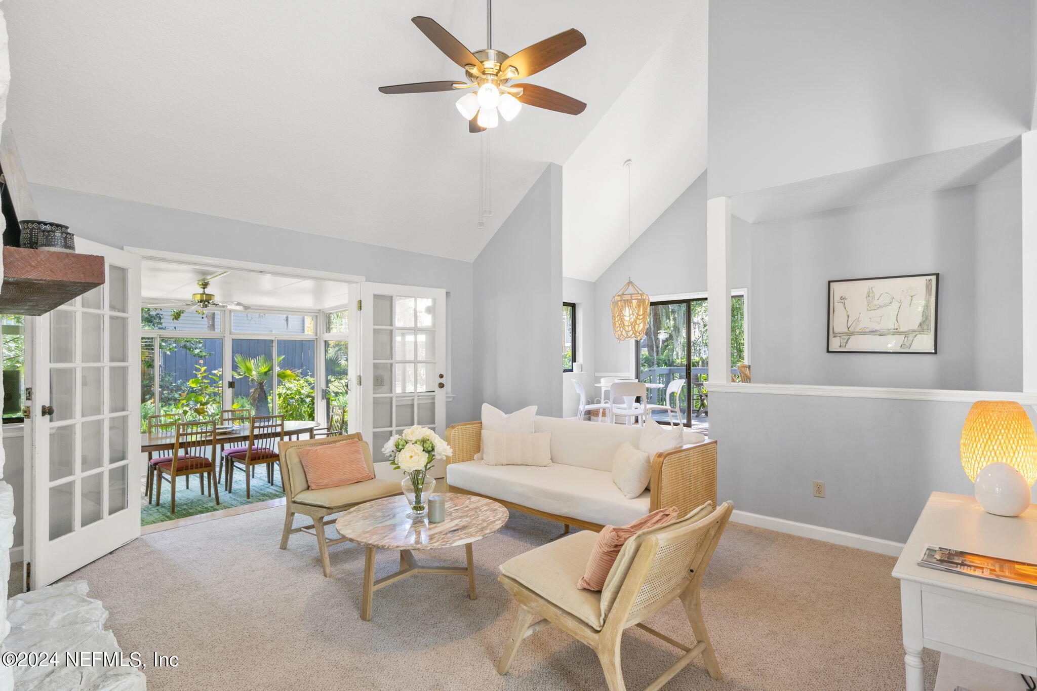 1350 Pinewood Road Jacksonville Beach, FL 32250 - Photo 9 of 55 a living room with furniture a ceiling fan and a window