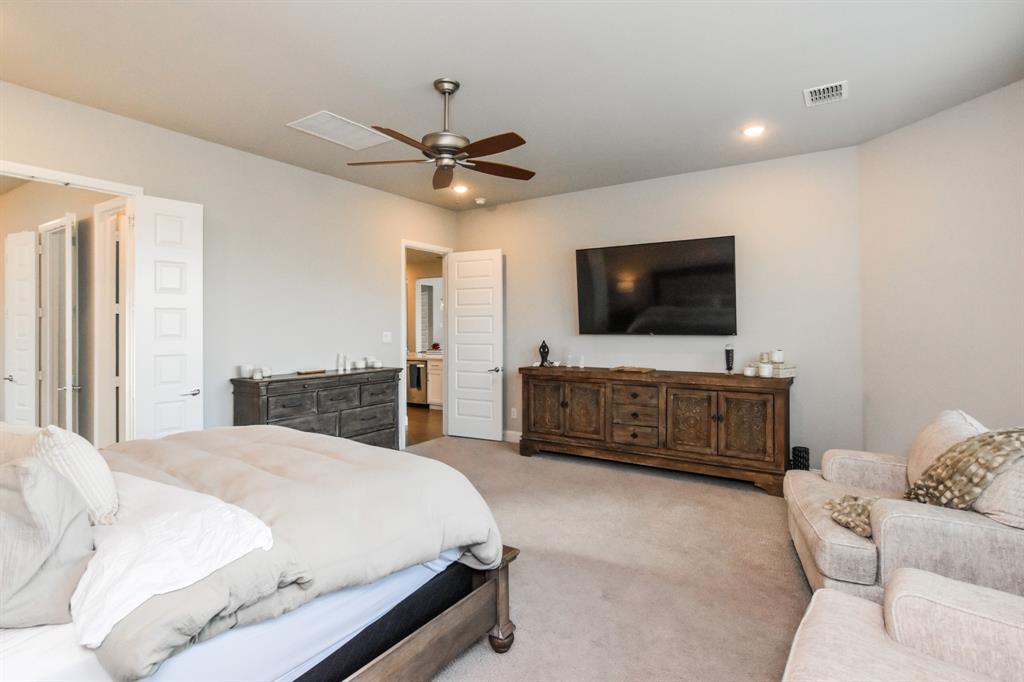 2516 Maidenhair Road Frisco, TX 75033 - Photo 14 of 30 a bedroom with a bed and a flat screen tv
