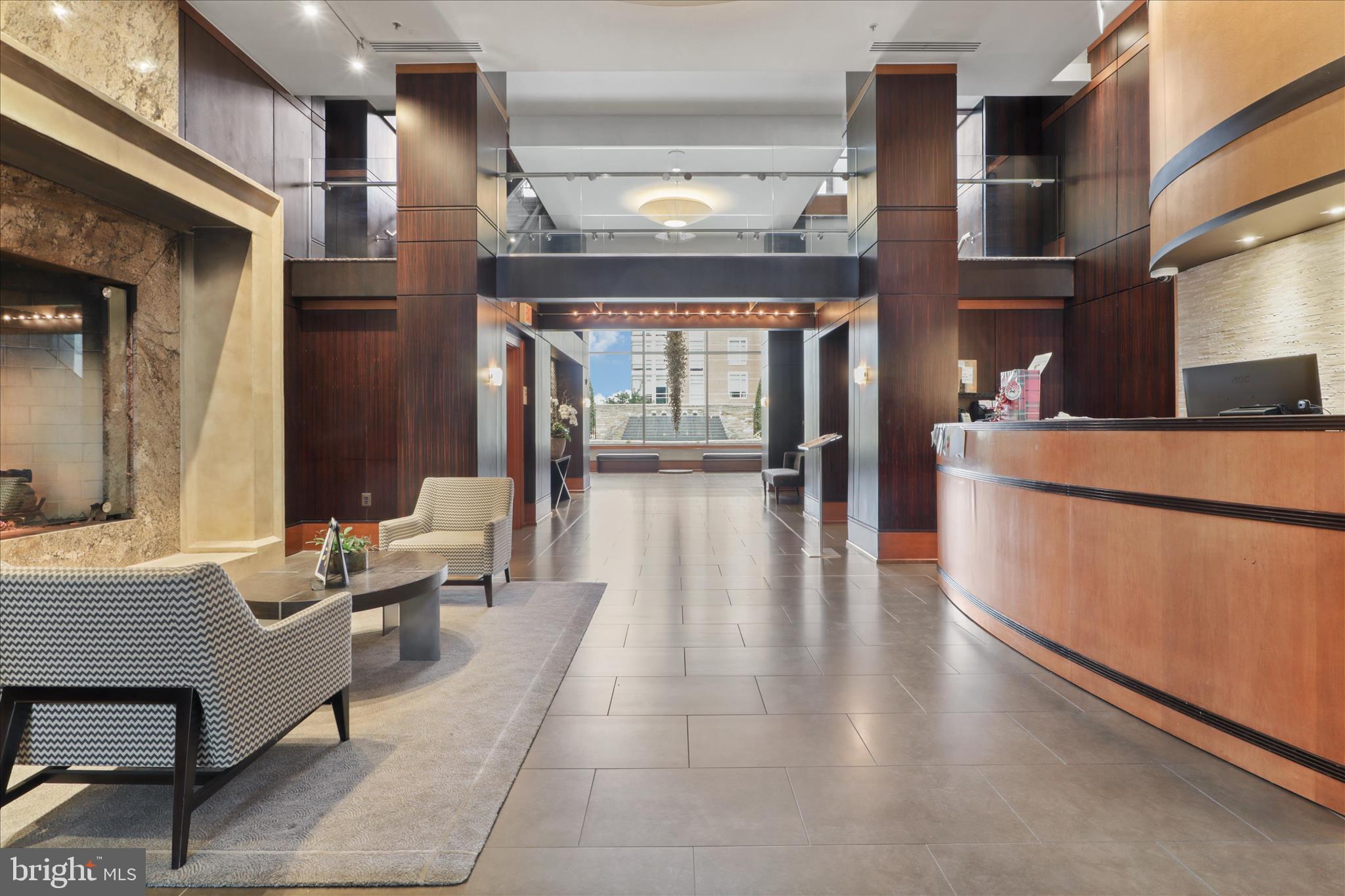 11990 Market Street, Unit 216 Reston, VA 20190 - Photo 6 of 41 a lobby with furniture and window