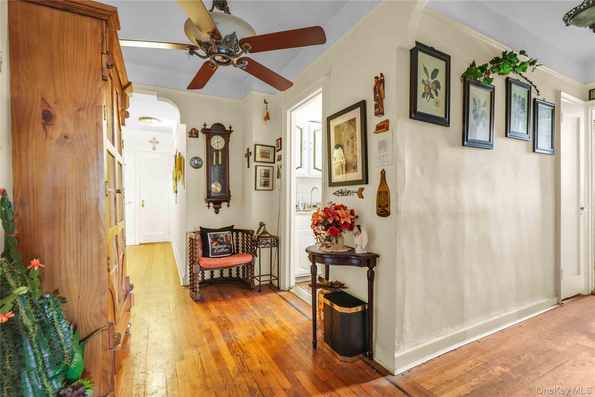 167-10 Crocheron Avenue, Unit 1F Queens, NY 11358 - Photo 14 of 16 a bedroom with a bed and a chandelier