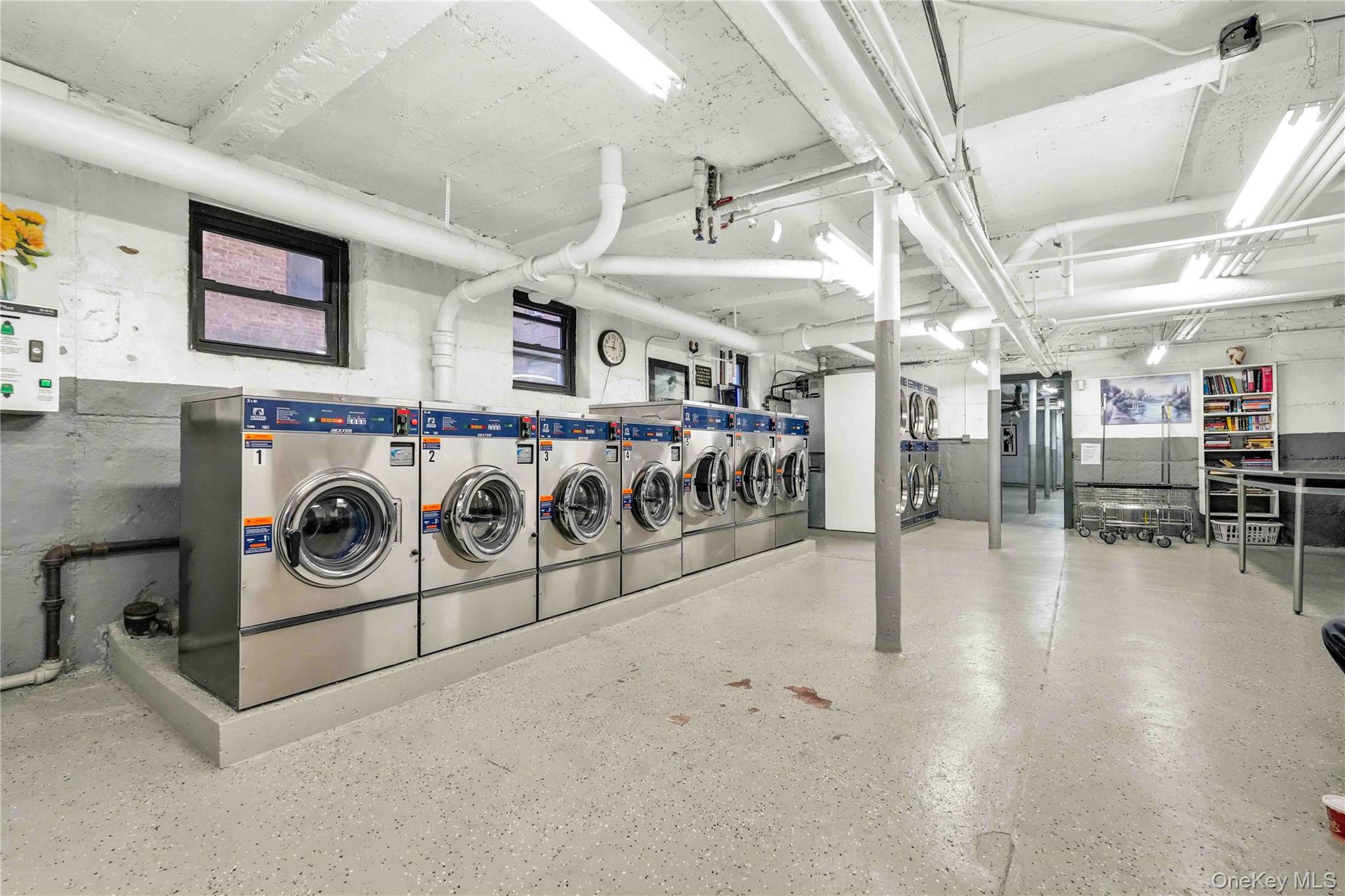 167-10 Crocheron Avenue, Unit 1F Queens, NY 11358 - Photo 15 of 16 a utility room with lots of wooden furniture