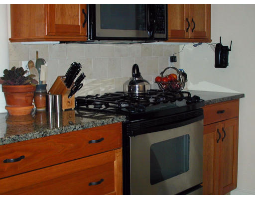 32 Elinor Road Newton, MA 02461 - Photo 6 of 7 a kitchen with a stove and cabinets
