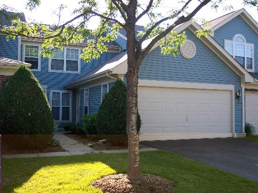 704 Bent Ridge Lane, Unit 704 Elgin, IL 60120 - Photo 1 of 1 front view of house with a yard