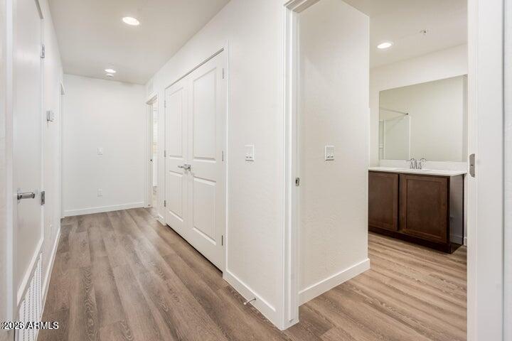 21606 North 23rd Avenue, Unit 202 Phoenix, AZ 85027 - Photo 4 of 11 a view of a hallway with wooden floor
