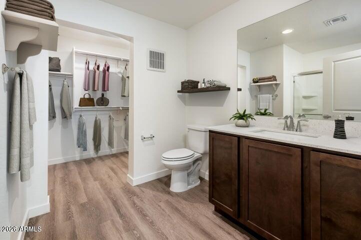 21606 North 23rd Avenue, Unit 202 Phoenix, AZ 85027 - Photo 7 of 11 a bathroom with a sink a toilet and shower