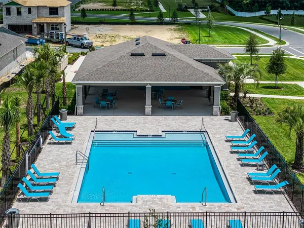 a view of a swimming pool and a yard