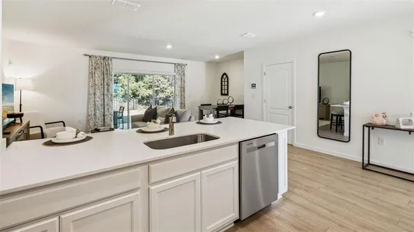 a kitchen with a sink and cabinets