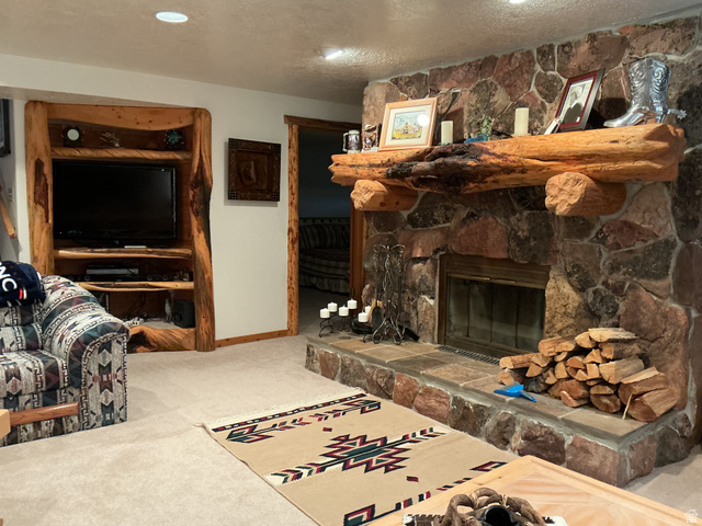 550 State Line Road Manila, UT 84046 - Photo 17 of 41 Stone fireplace with a substantial log mantel and hearth