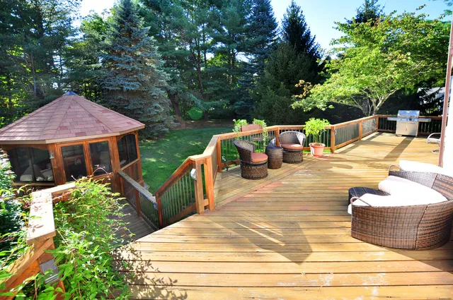a view of a patio with chairs and plants