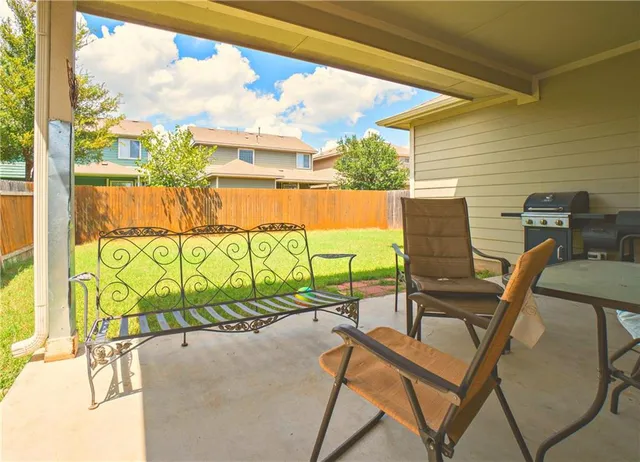 a view of balcony with furniture