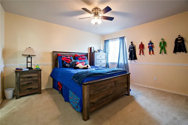 a bed room with a bed and a chandelier