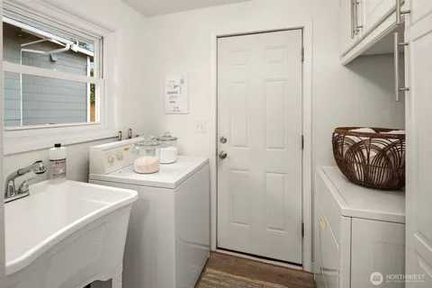 a bathroom with a sink a toilet and mirror