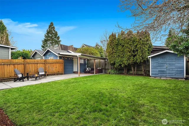a front view of a house with patio and garden