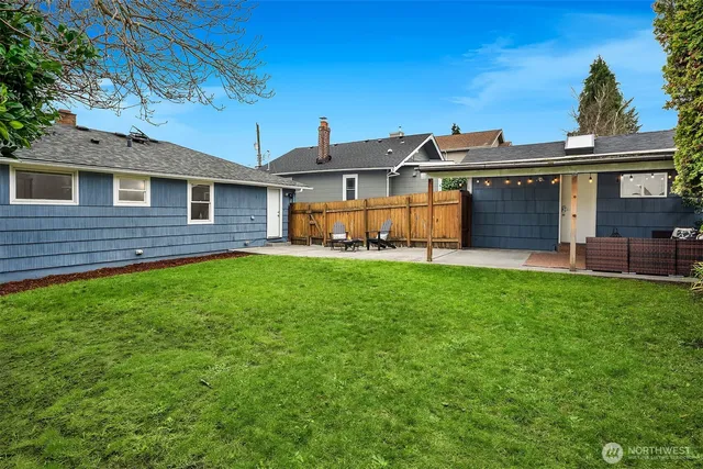 a view of a house with a yard and porch