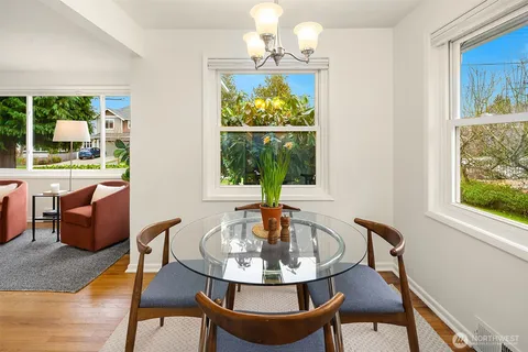 a view of a dining room with furniture window and outside view