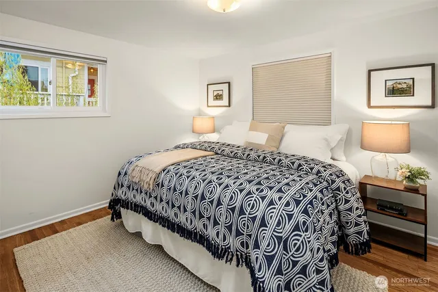 a bedroom with a bed and lamp