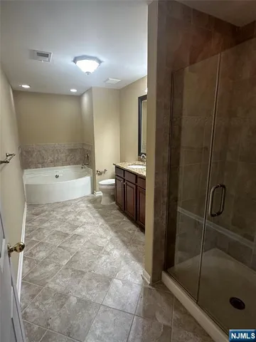 a bath room with a sink and a large mirror