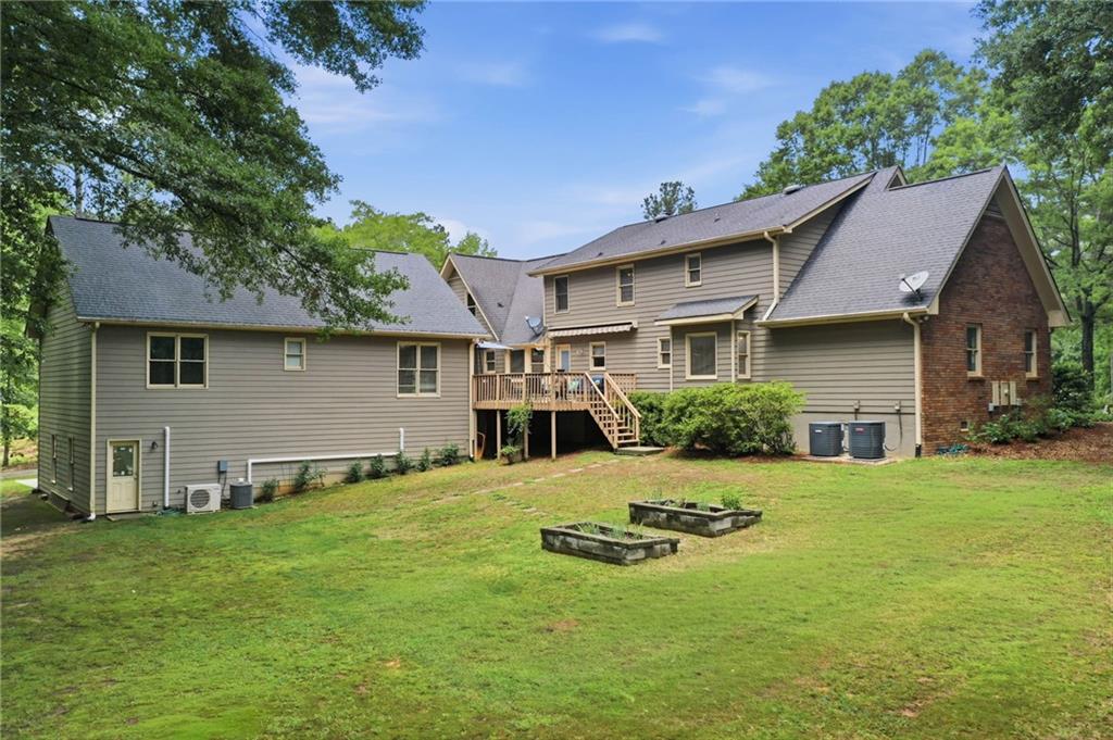 4891 Bill Cheek Road Auburn, GA 30011 - Photo 61 of 99 a view of a house with a yard and chairs