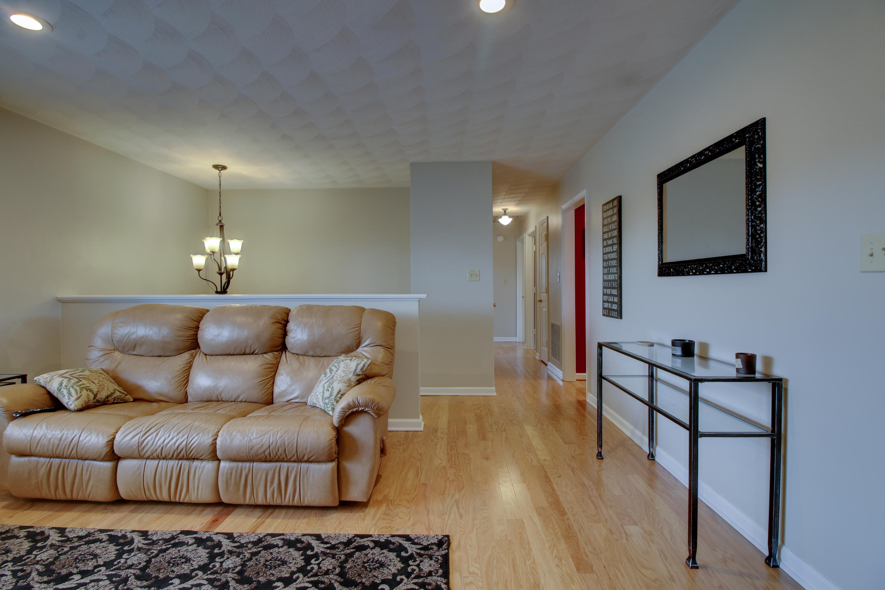 6704 Trevilian Road Roanoke, VA 24019 - Photo 12 of 46 a living room with furniture and a chandelier