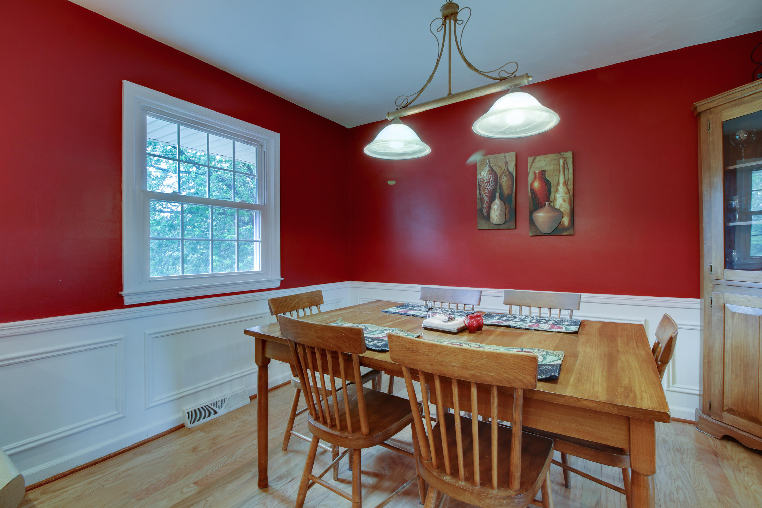 6704 Trevilian Road Roanoke, VA 24019 - Photo 15 of 46 a view of a dining room with furniture window and wooden floor