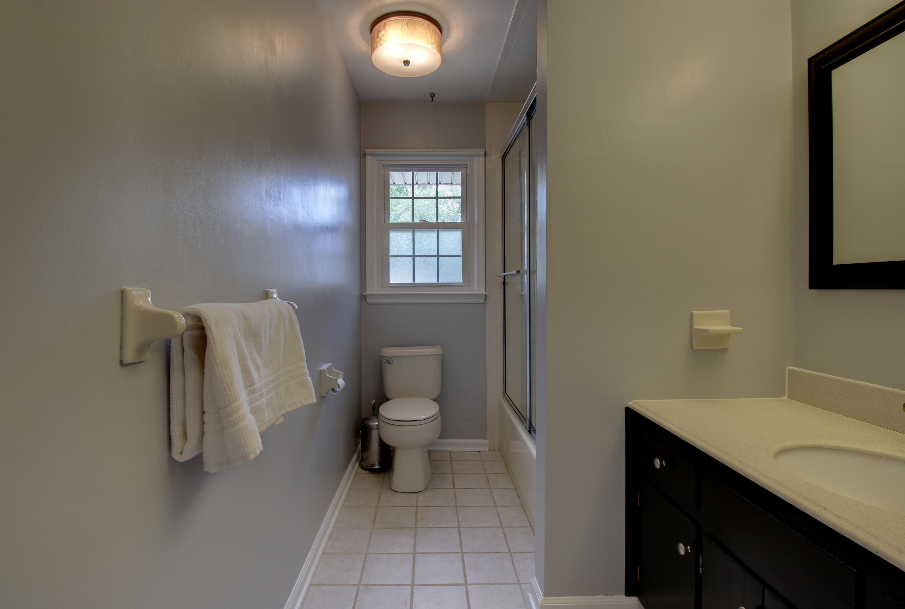 6704 Trevilian Road Roanoke, VA 24019 - Photo 25 of 46 a bathroom with a toilet sink and mirror