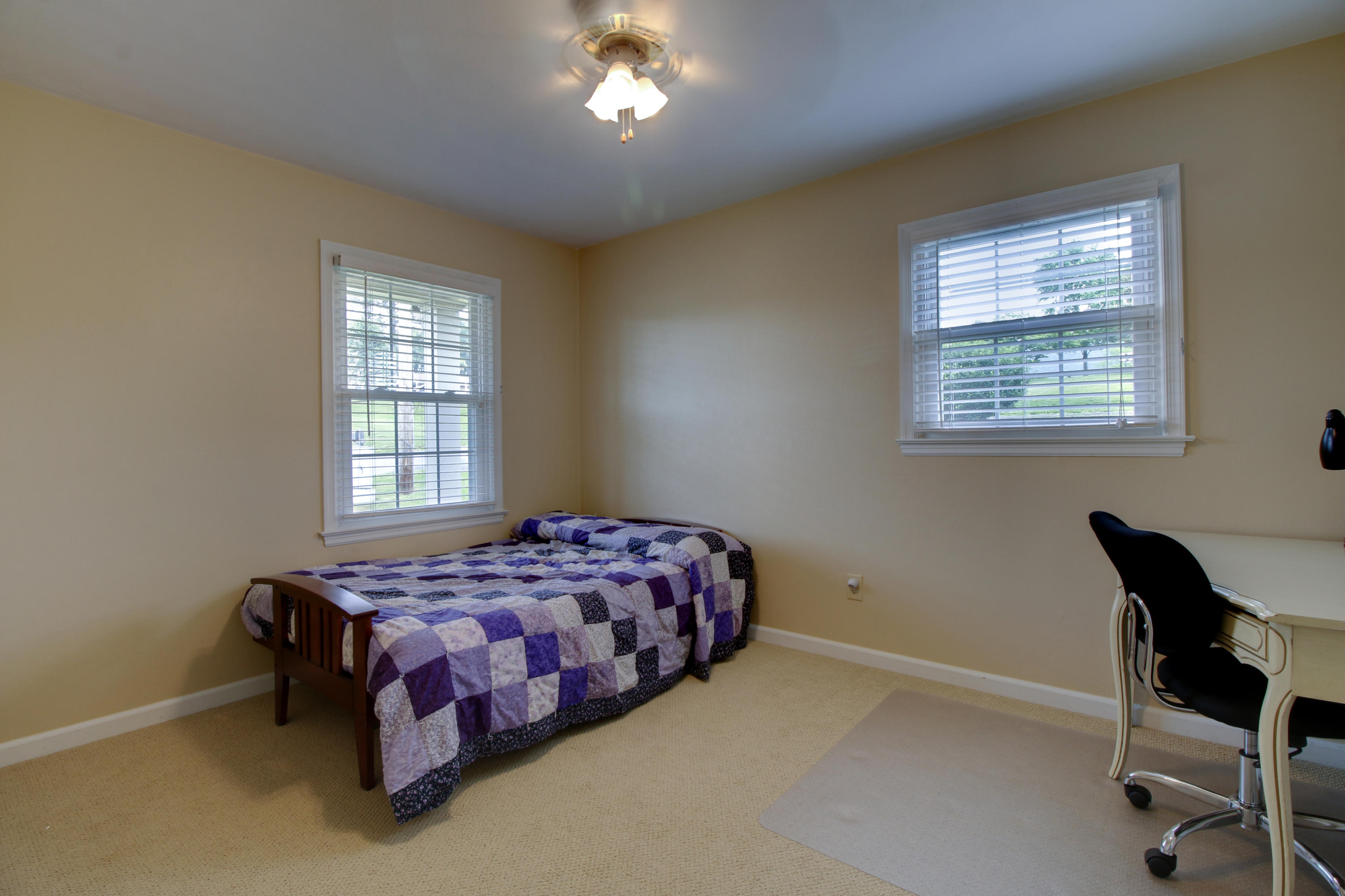 6704 Trevilian Road Roanoke, VA 24019 - Photo 29 of 46 a bedroom with a bed chair and windows