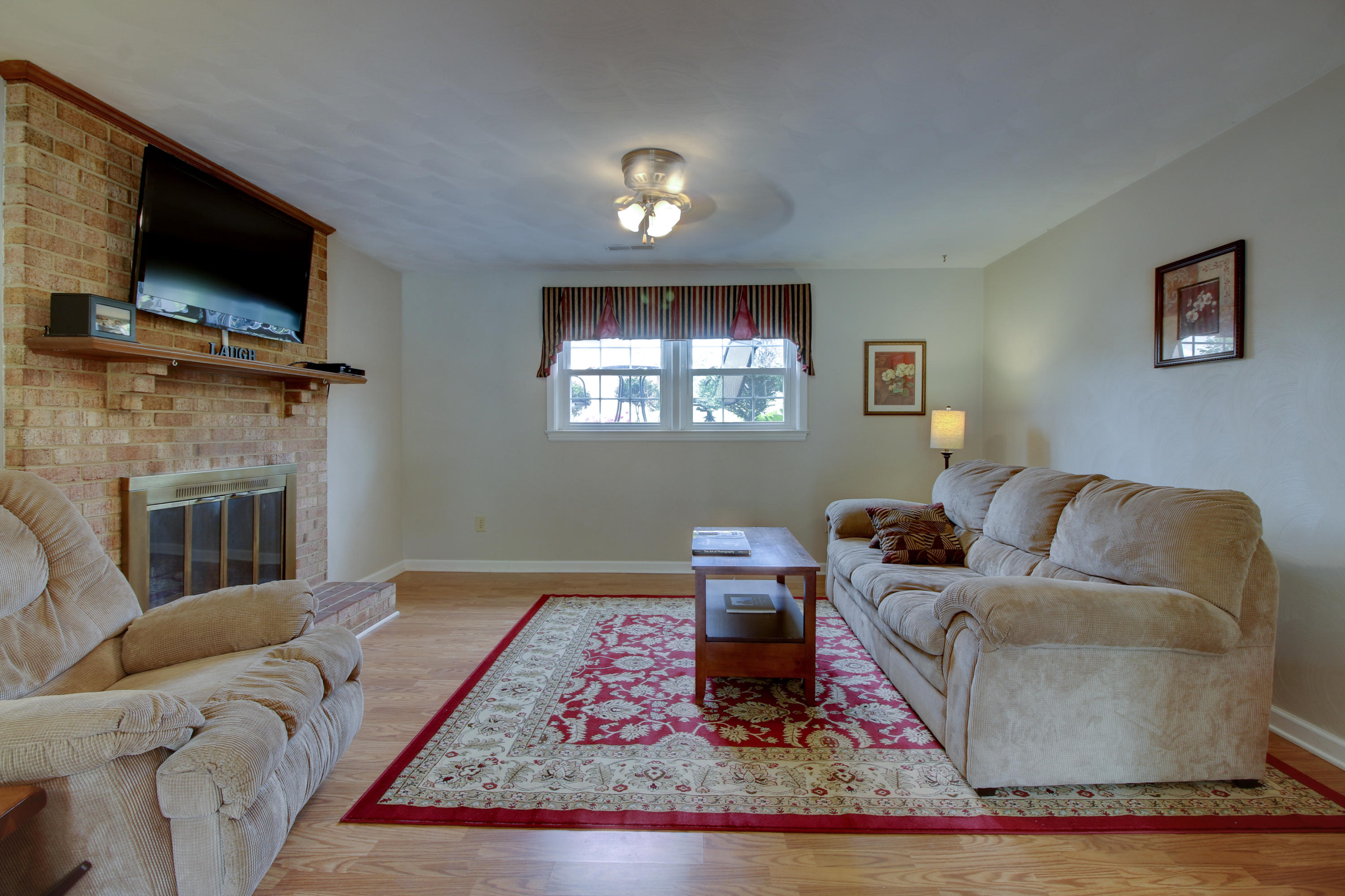 6704 Trevilian Road Roanoke, VA 24019 - Photo 33 of 46 a living room with furniture and a flat screen tv