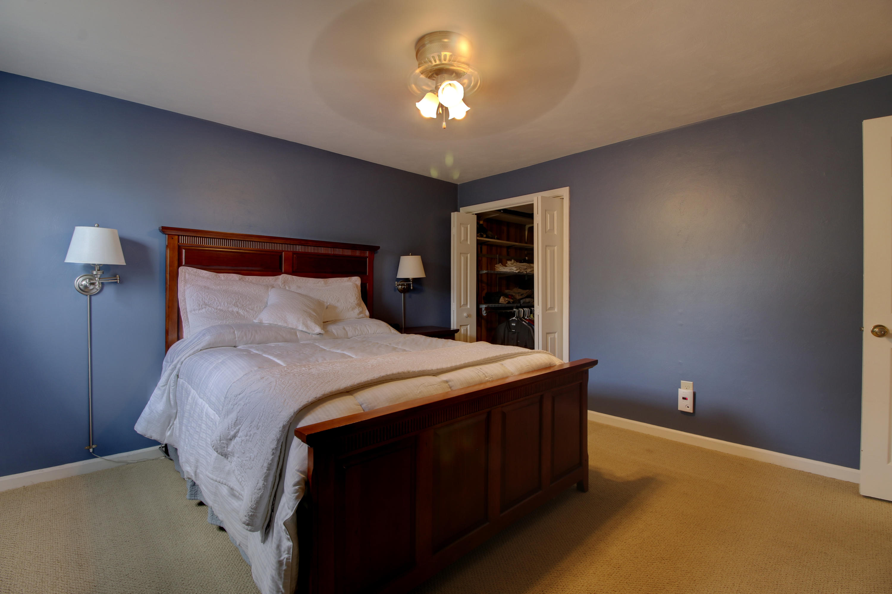 6704 Trevilian Road Roanoke, VA 24019 - Photo 38 of 46 a bedroom with a bed and a chandelier
