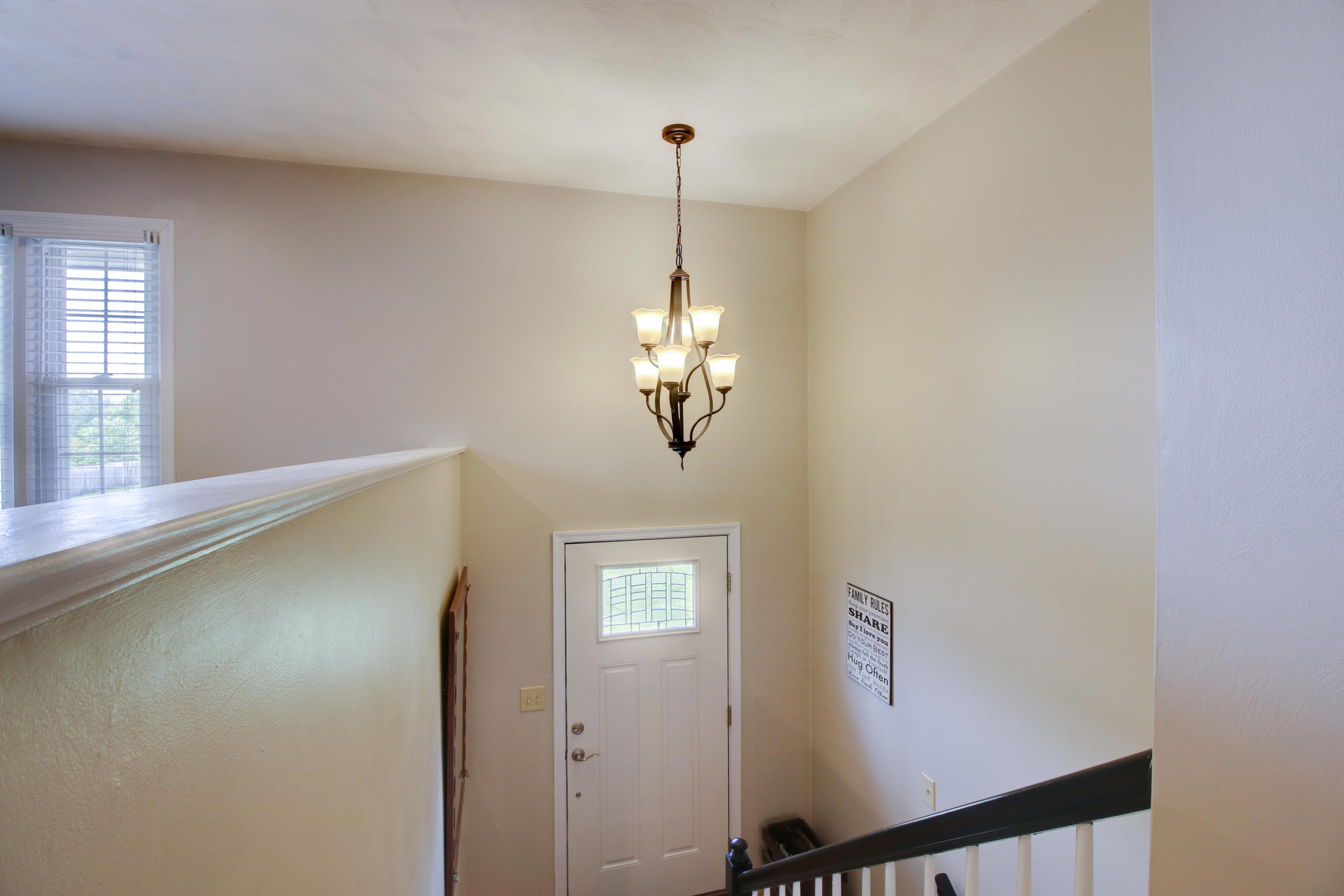 6704 Trevilian Road Roanoke, VA 24019 - Photo 8 of 46 a view of a hallway with windows and chandelier